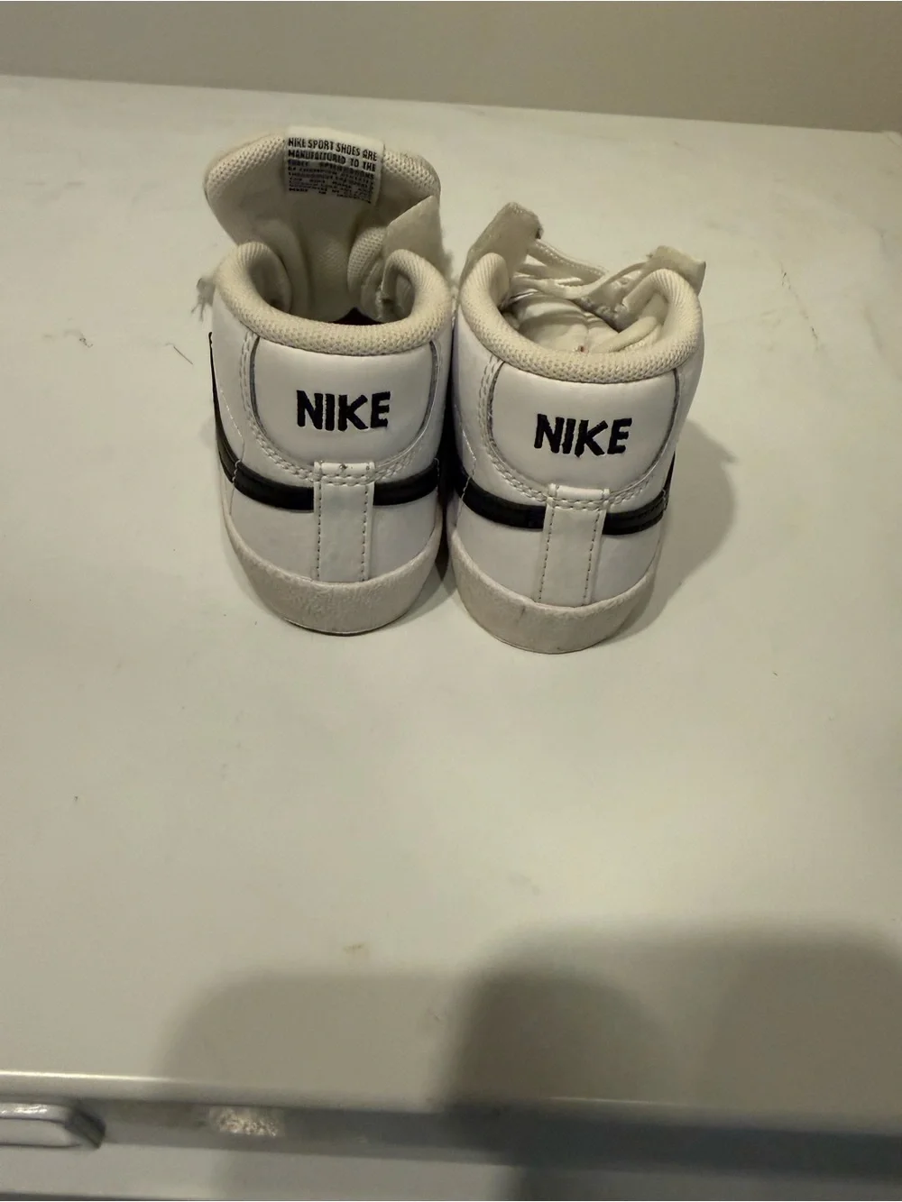 Nike Kids White High-Top Sneakers with Black Swoosh